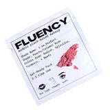 Fluency makeup product packaging with a swatch of pink color on a white background