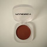 Open vegan, plant-based clean makeup compact with brown blush on a light background