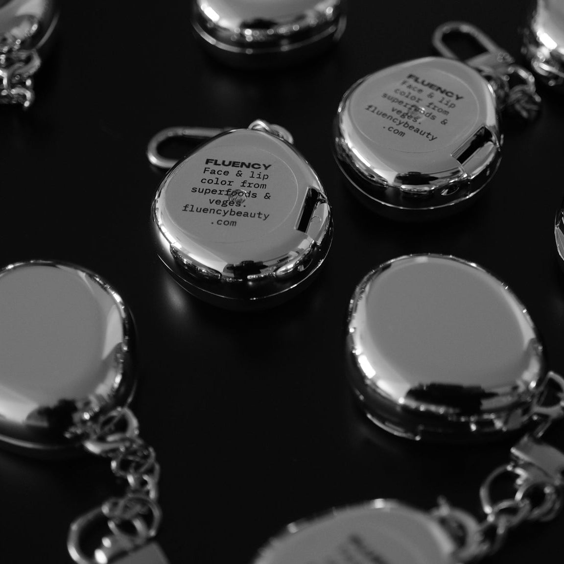 Fluency Keychains chic modern in silver chrome, multiple pieces in stylized disarray
