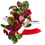fluency lipstick multistick blue red shade over a beet salad with aesthetic flowers showcasing its made from beets