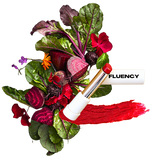 fluency lipstick multistick blue red shade over a beet salad with aesthetic flowers showcasing its made from beets