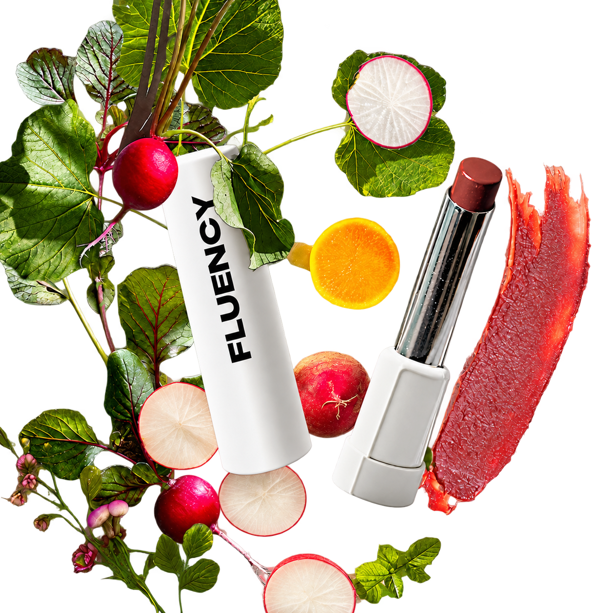 A white cosmetic tube labeled 'FLUENCY' is arranged with fresh radishes, red beets, green leaves, and a red lipstick smear on a white background.