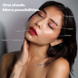 infographic showing the different ways to wear fluency vegan makeup on a dark haired model, showing cheeks, lips, eyes, contour in a red shade makeup with blue undertones with the name i am brave
